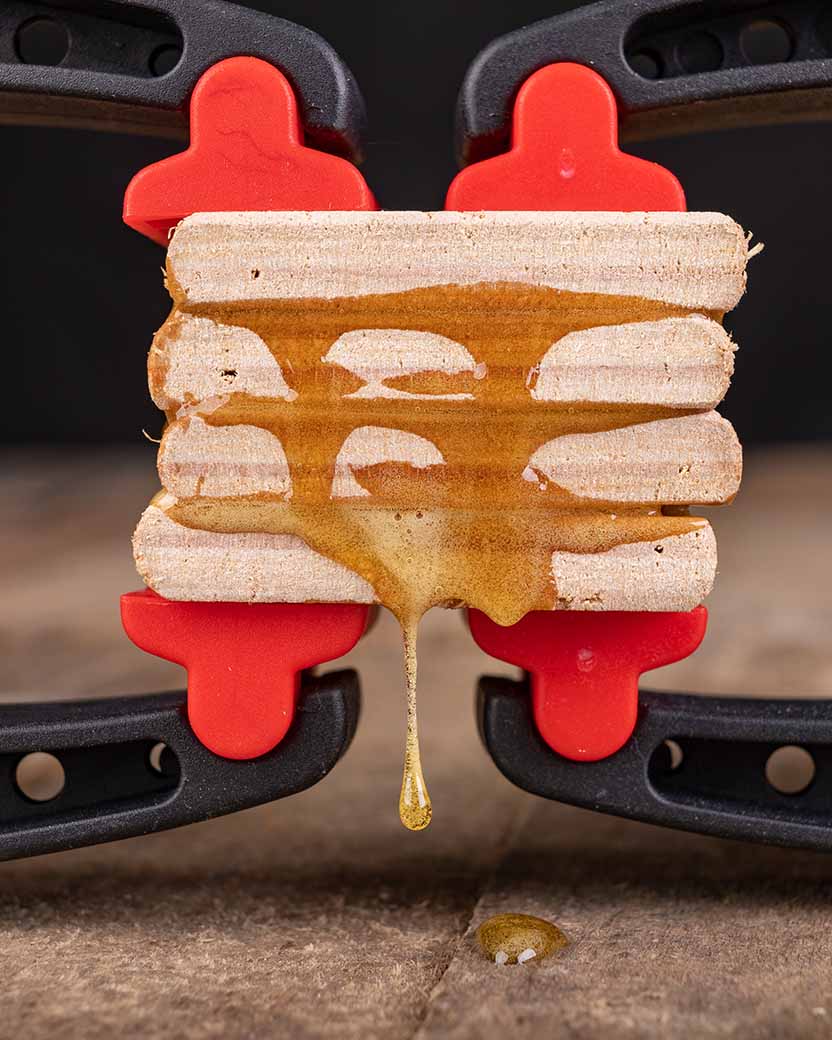Wooden cross sections glued with expanding glue and clamped together.